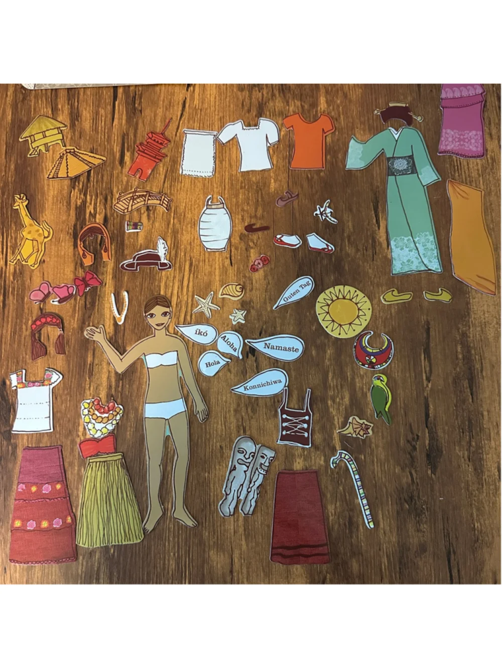 Mudpuppy World Traveler Magnetic Dress Up Doll Set Tin Clothing Accessories